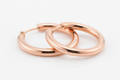 Polished rose gold hoop earrings